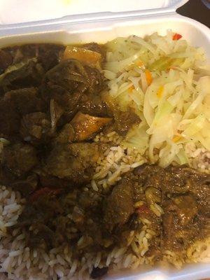 Curry Goat dinner with rice & peas and steamed vegetables