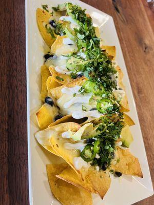 House nachos / Black beans or refried
beans,cheese,avocado,fresh jalapeño,sour cream, cilantro