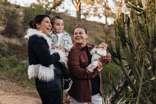 Beautiful lesbian family at Encinitas botanical garden in San Diego, CA.