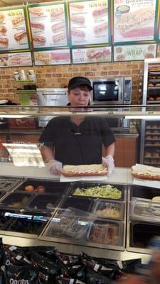 Sandwich maker doing her thing.