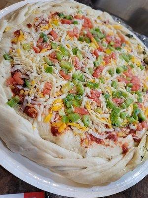 Raw stuffed pizza. Before going in our oven