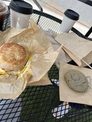 Latte and cold brew with brown sugar syrup, tomato egg breakfast sandwich, veggie quiche, and blue corn cookie