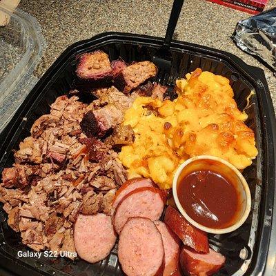 Polish sausage, brisket, burnt ends, mac n cheese with sweet and spicy BBQ sauce