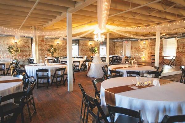 Industrial Chic Factory Venue with Bridal Suite, All Hardwoods, Exposed Beam Ceilings, Grand Staircase, and Private entrances.