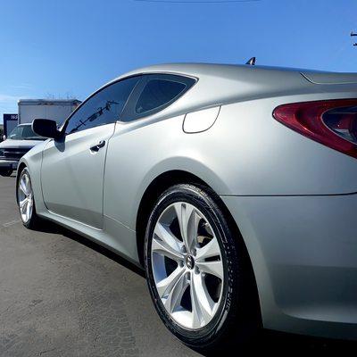 Hyundai Genesis after a color change vinyl wrap using Avery Dimension matte metallic Anthracite.