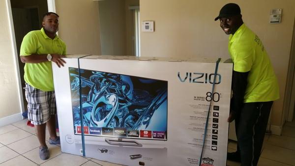 Pierre taking extra care of packing my 80" tv.  He even found a way to pack the tv with the stand! Genius!