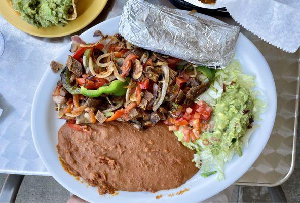 Lunch Fajita Vegana  with vegan sausage and double refried beans instead of rice.