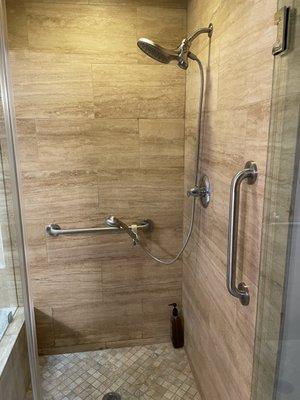 Shower wand extension added for shower chair