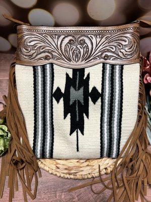 Tooled leather and saddle blanket indian print purse.