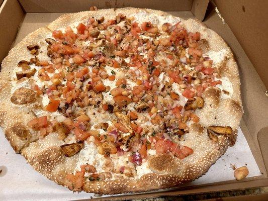 Signature sesame seed crust #9 with grilled chicken, fresh mozzarella, and bruschetta