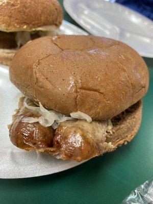 Bratwurst sandwich on wheat bun.