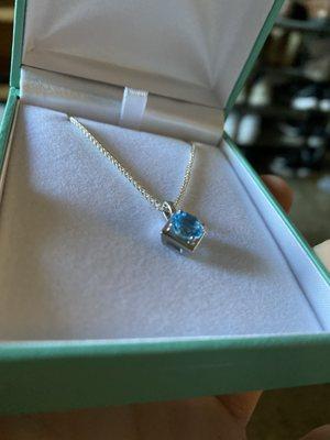 Custom Aquamarine necklace set in a rhodium-plated white gold housing with a silver chain.