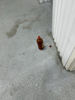 A bottle of god knows what in the garage.