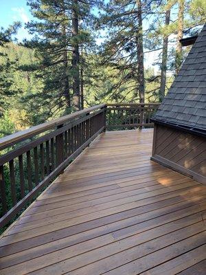 Semi transparent stain on deck.solid base stain on railing and entire exterior of cabin