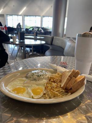 Chicken fried steak, eggs and hash browns.