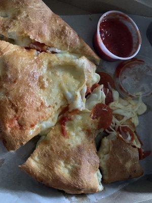 Pepperoni and cheese calzone.