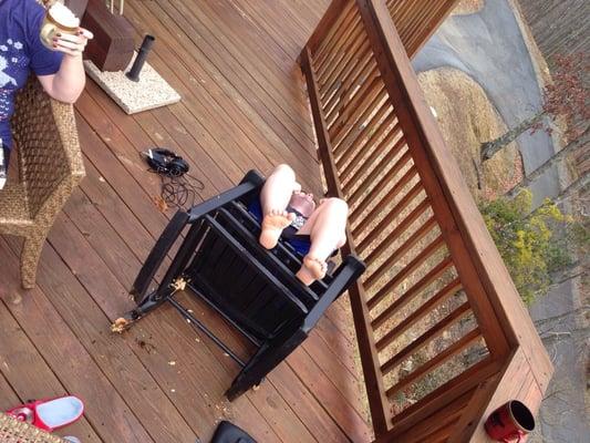 My brother in law taking a relaxing sit in the porch rocking chair. It was completely rotten through.