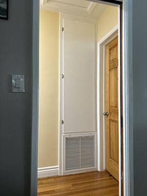 Heat pump behind door.