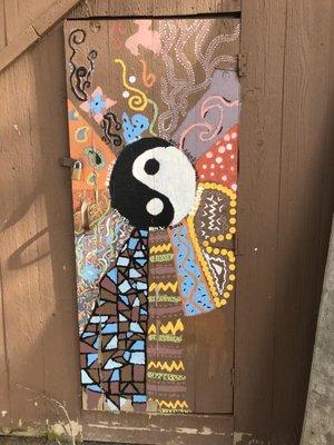 This painted door near the lake after walking through the bridge from the camp added a lot of character and soul from past campers.