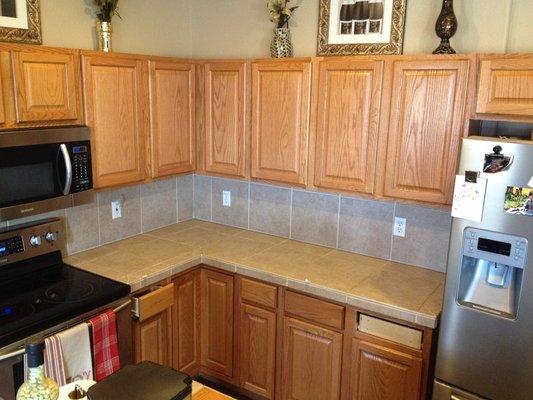 Typical golden oak kitchen cabinets restained: Before