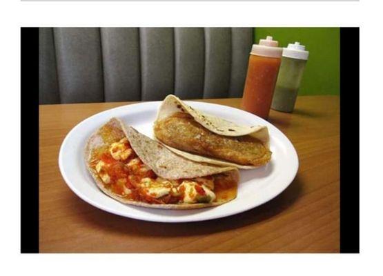 Two of our specialty tacos, Lengua lampriada, and Queso ranchero.