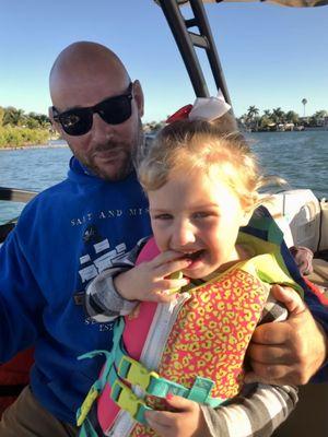 My daughter driving the boat with Captain Joe