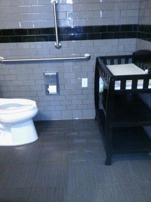 Although the door is not automatic, the restroom is clean, large enough for a wheelchair, and has a baby changing station. -E 5/15/18