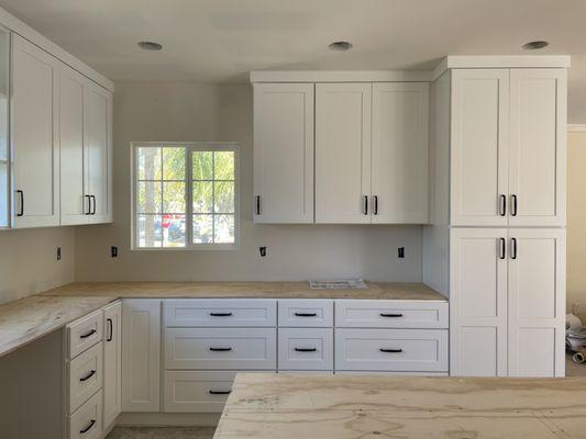 One wall of cabinets installed (pre-countertop).