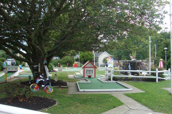 Classic mini golf course next to the outdoor tables.