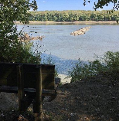 A bench overlooks the Missouri on the River Trail.