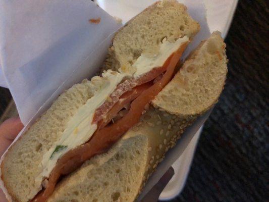 Sesame bagel with scallion cream cheese,lox and onions.