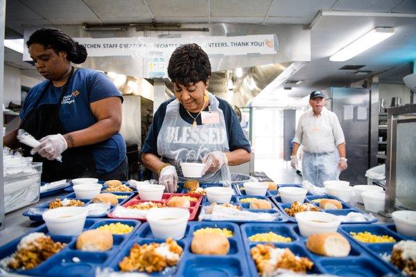 72 volunteers are needed to serve over 3,000 meals each day to neighbors in need.