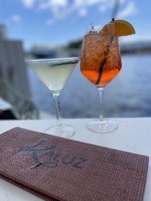 Aperol spritz and cucumber lime martini water side