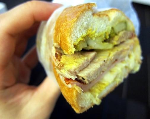 Sandwich with roast pork, ham, mustard...