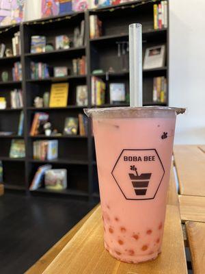 Strawberry milk tea and passion fruit popping boba.