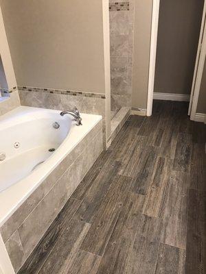 Shower bath tub floor remodel... Wood look tile