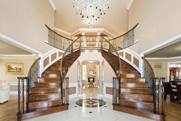 The favorite part of my home, my grand double staircases, elegant chandelier, and timeless design.