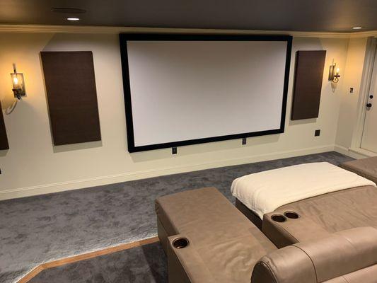 A completed view of this custom room remodel. The speakers are concealed behind the acoustically transparent screen.