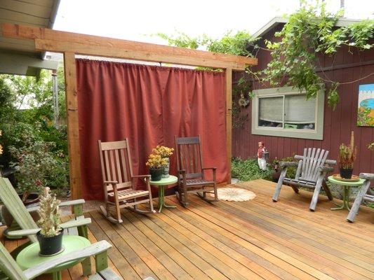 Sunbrella outdoor curtain pair, by M&C Tailoring.  Deck and torii gate by Aaction Builders,