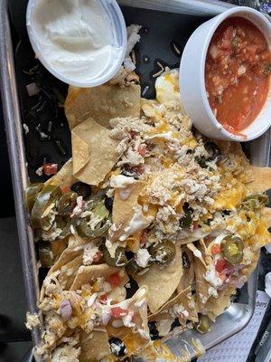 Partially eaten chicken nachos