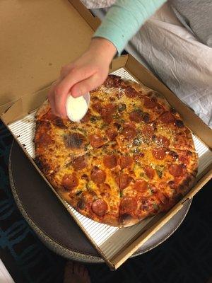 Pepperoni and mushroom in the hotel room. Just adding some parm!