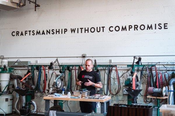 STEELPORT's Bladesmith and Co-Founder Eytan Zias leading a sharpening demo at the factory.