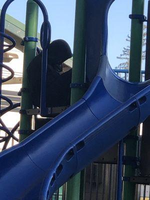 Creepy weirdo sitting on the playground, was blocking access to the slide until and adult intervened. Don't leave little ones alone.