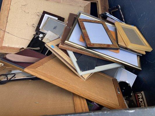 People donated these nice looking picture frames, and they are dumped in the trash.