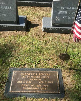 My father's VA marker with the rest of the family in the background.