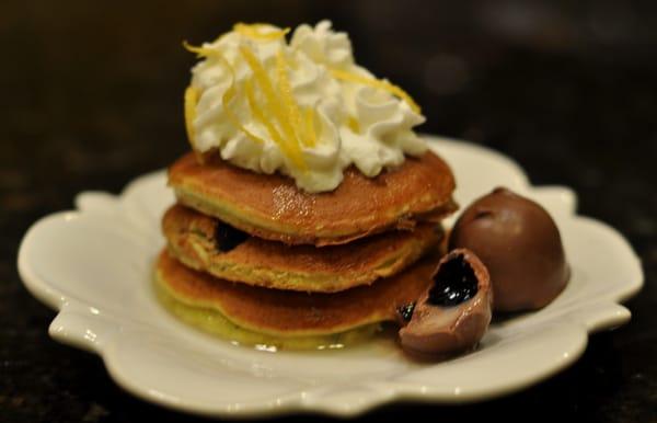 Blueberry Ginger Bellini Pancakes - Blueberry Ginger Pancakes with Sweet Champagne Glaze, Whipped Cream, Lemon Zest, and Chocola