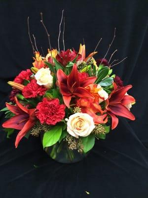 Fall arrangement of lilies and roses