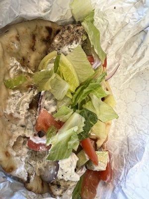 chicken souvlaki warm pita loaded with marinated meat and topped with tzatziki with fresh tomato, cucumber, onion, lettuce