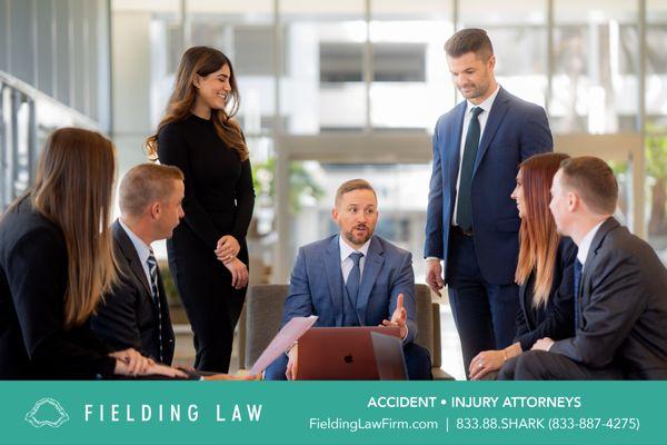 Collaborative team effort at Fielding Law! Our dedicated team works together to develop the best strategies for our clients' success.