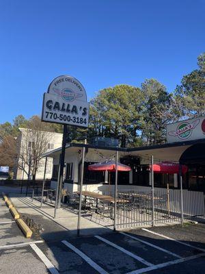 Sign and outdoor seating